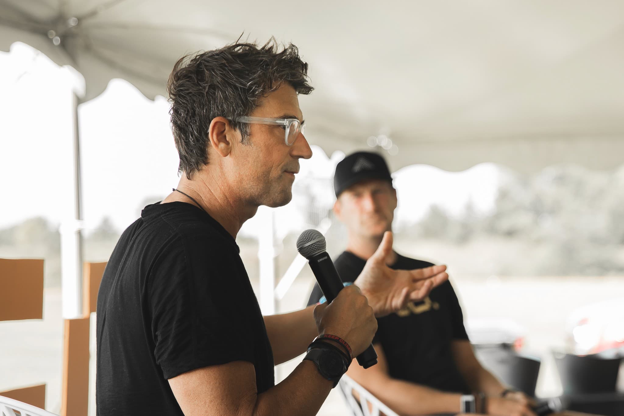 Joe Chura speaking on stage